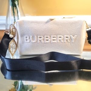 Burberry Pouch converted to shoulder/cross body. Used for party. Passing it on.